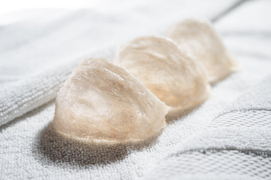 Premium edible bird’s nest ingredient on soft white fabric, highlighting hydrolyzed swiftlet nest extract used in skincare for acne-prone skin, skin barrier support, hydration, and microbiome-friendly skincare.