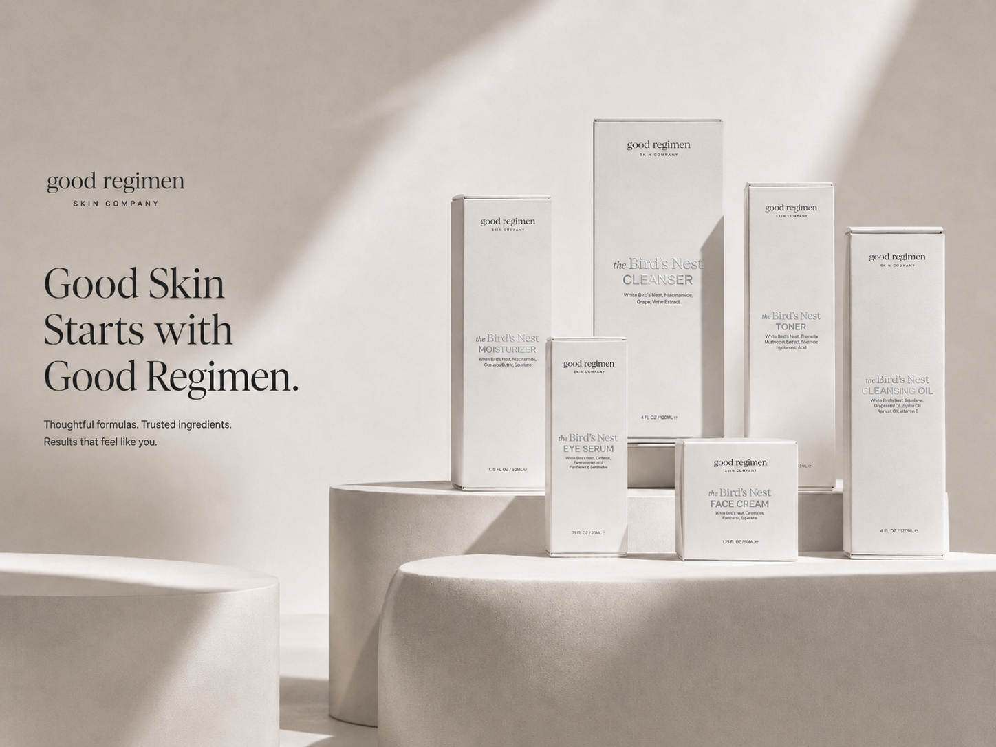 Good Regimen Skin Company Bird’s Nest skincare collection displayed in a minimalist luxury homepage hero image with cleanser, toner, moisturizer, eye serum, face cream, and cleansing oil.