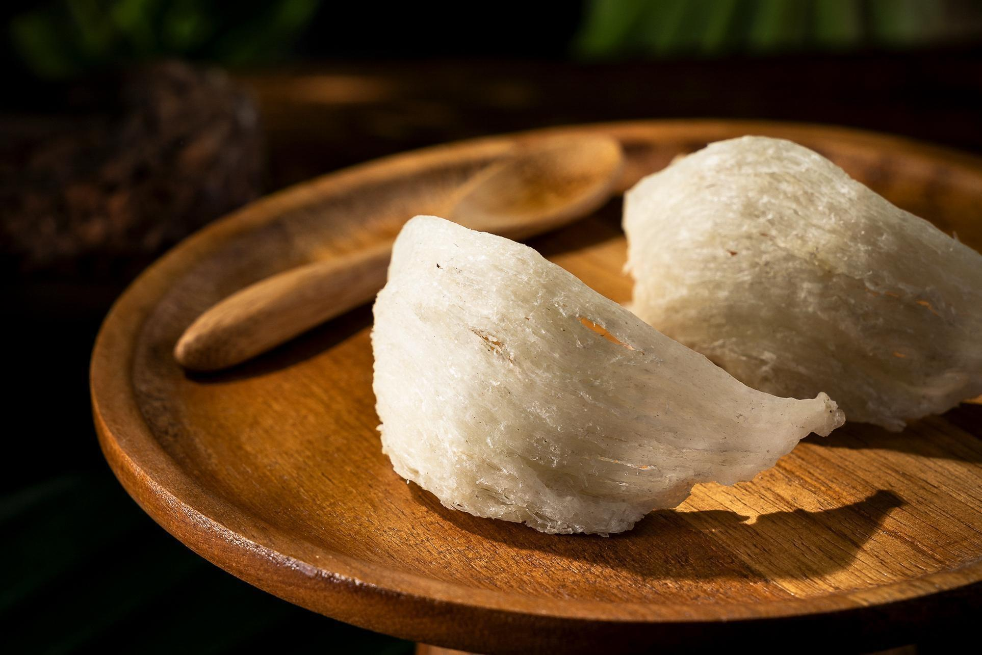 White Bird’s Nest skincare ingredient on a wooden plate, used in Good Regimen formulas for nourishing, hydrating, and skin-conditioning benefits.